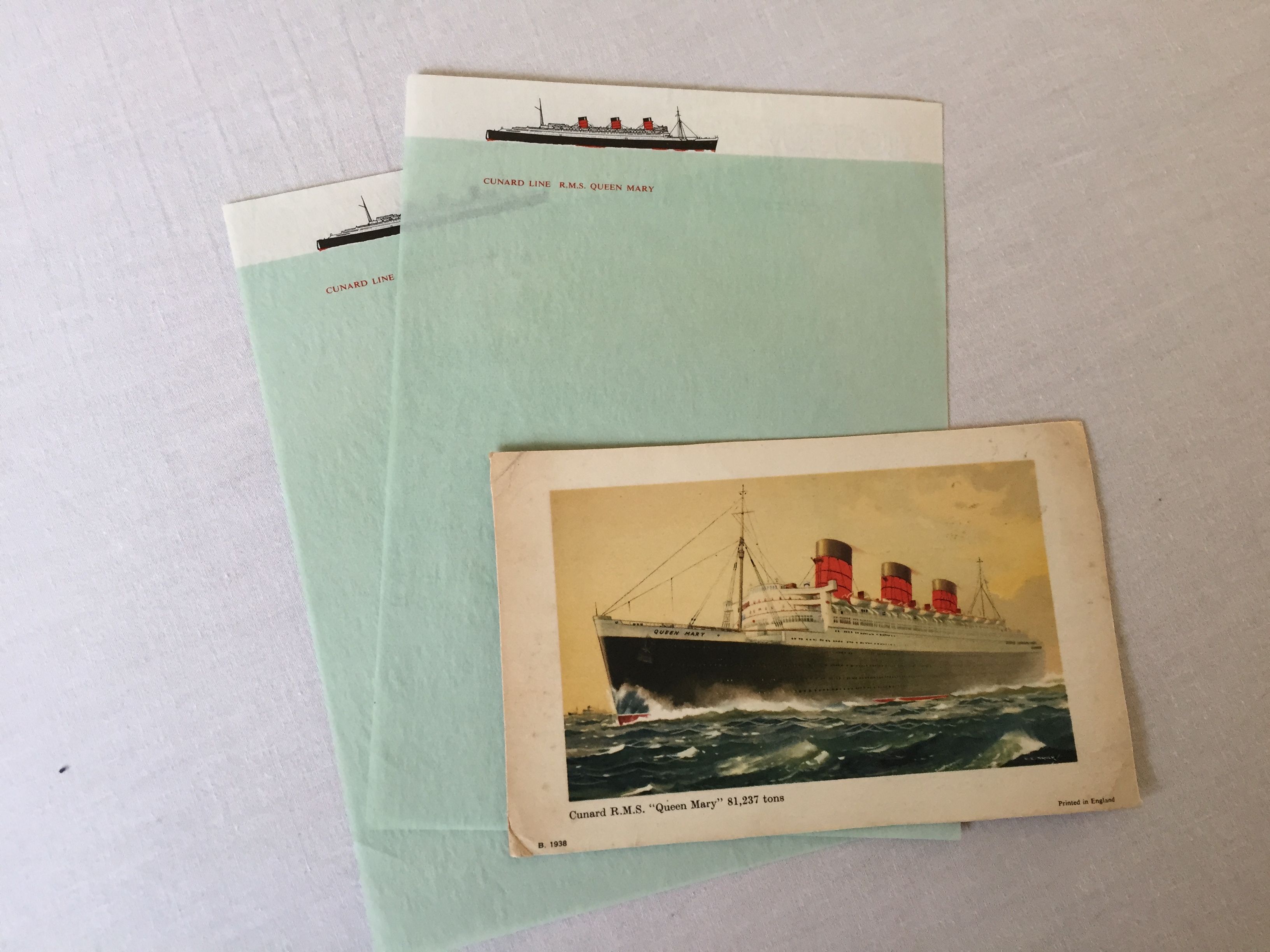 LOG CARD AND UNUSED EARLY CABIN WRITING PAPER FROM THE RMS QUEEN MARY 